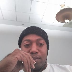 18K gold plated chain with money sign medallion